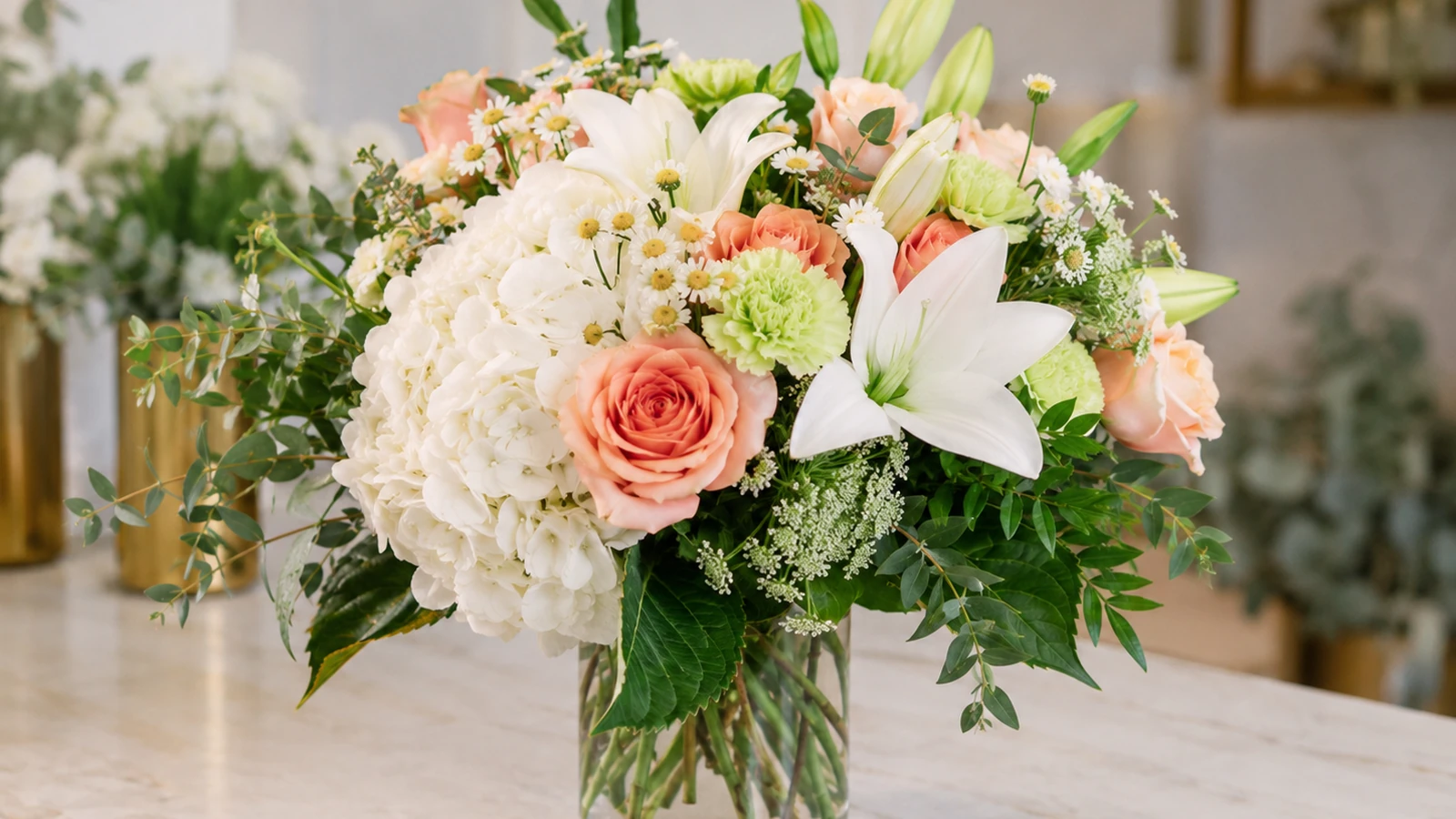 Elegant white funeral flowers with lilies and soft greenery for a Velvet Rose guide