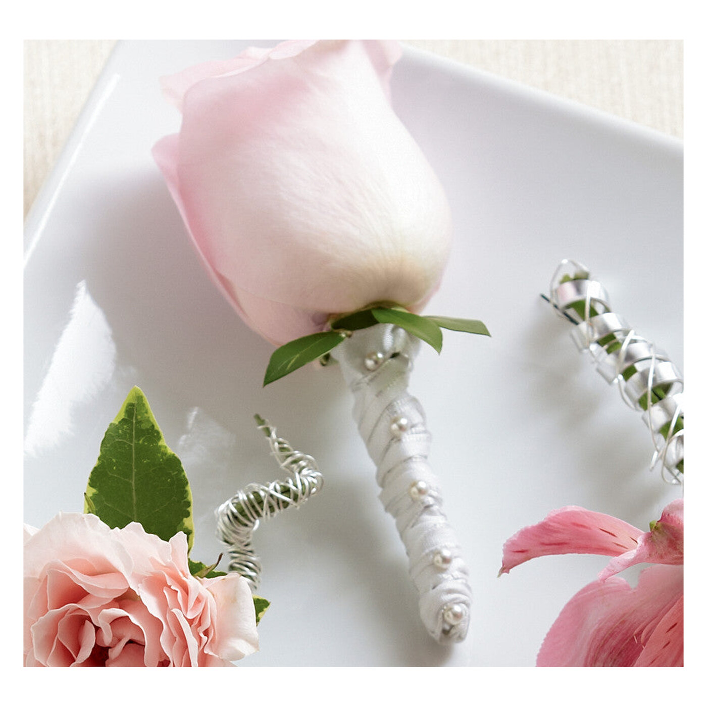 Pink Rose Boutonniere flower arrangement